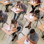 Elevated view of students writing their GCSE exam